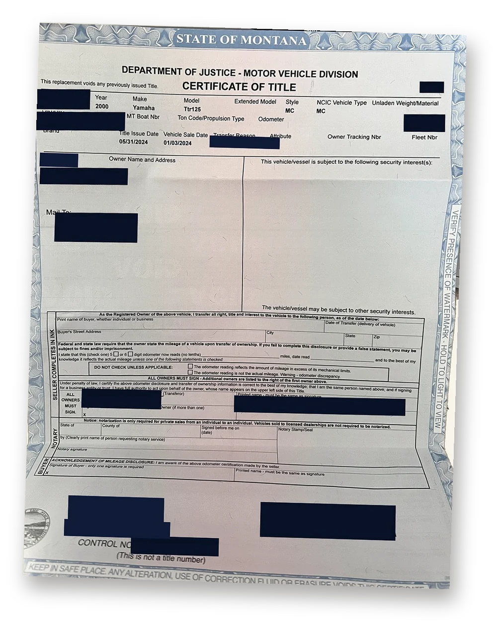 A Montana certificate of title we obtained for a 2000 Yamaha motorcycle. Owner details and the issuing office are blacked out.